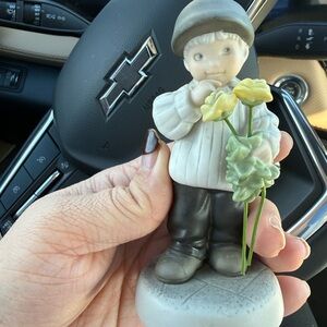 Charming Boy Figurine with Yellow Flowers